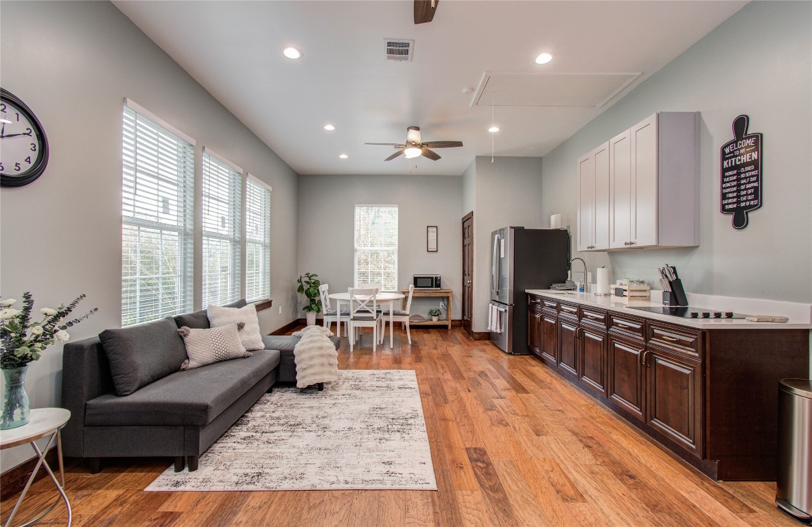25910 Maplewood Drive Spring, TX 77386 - Photo 44 of 50 a living room with stainless steel appliances granite countertop furniture wooden floor and a view of kitchen