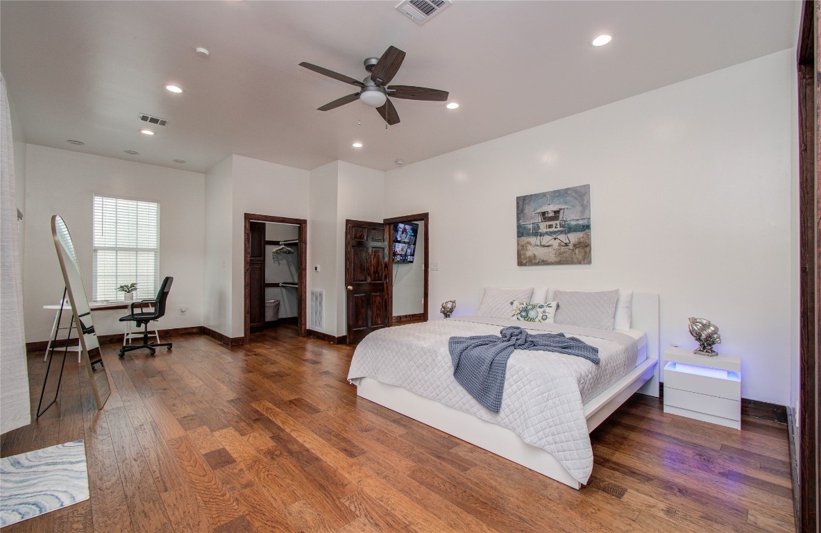 25910 Maplewood Drive Spring, TX 77386 - Photo 46 of 50 a spacious bedroom with a bed and a chair