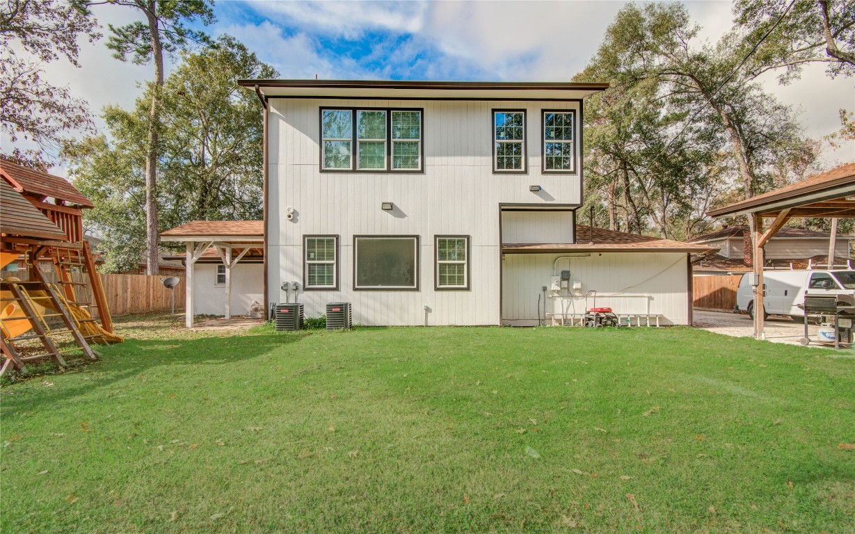 25910 Maplewood Drive Spring, TX 77386 - Photo 9 of 50 a view of a yard in front of a house