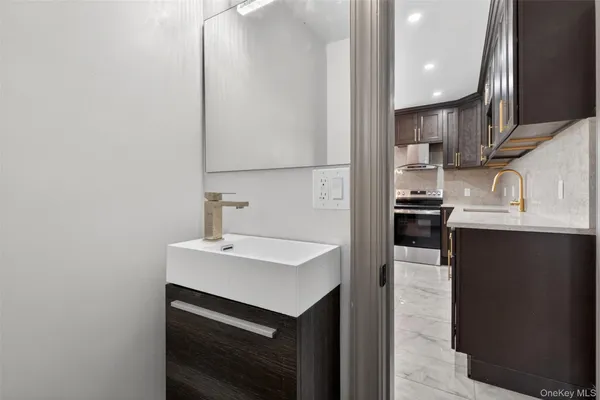 a kitchen with a sink cabinets and appliances