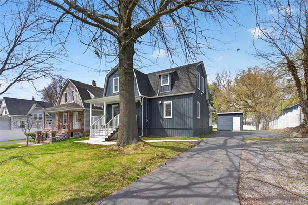 a view of a building with a yard