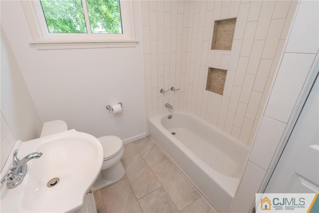 94 Oxford Road Colonia, NJ 07067 - Photo 19 of 27 a bathroom with a bathtub and a shower