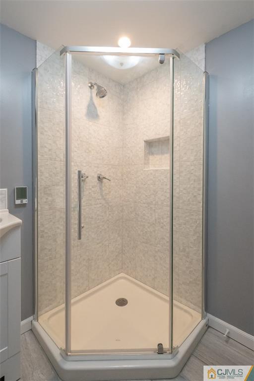 94 Oxford Road Colonia, NJ 07067 - Photo 23 of 27 a bathroom with a glass shower door