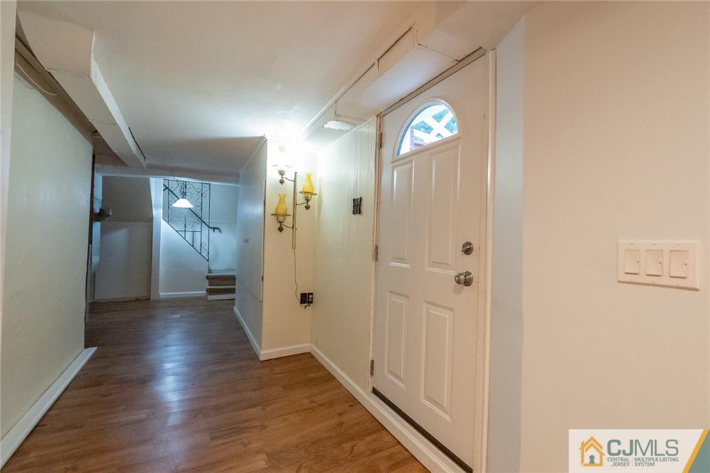 94 Oxford Road Colonia, NJ 07067 - Photo 25 of 27 a view of a hallway with wooden floor