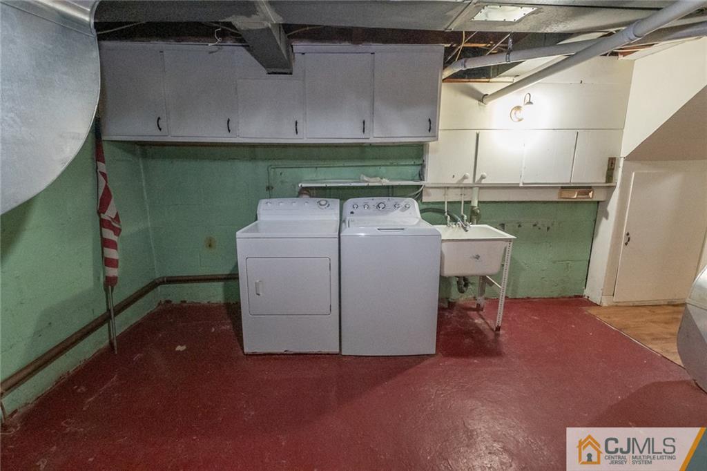 94 Oxford Road Colonia, NJ 07067 - Photo 26 of 27 a utility room with dryer and washer