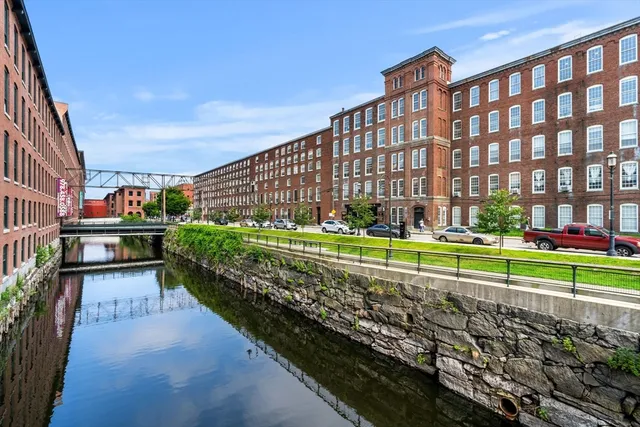 a view of a brick building with a yard