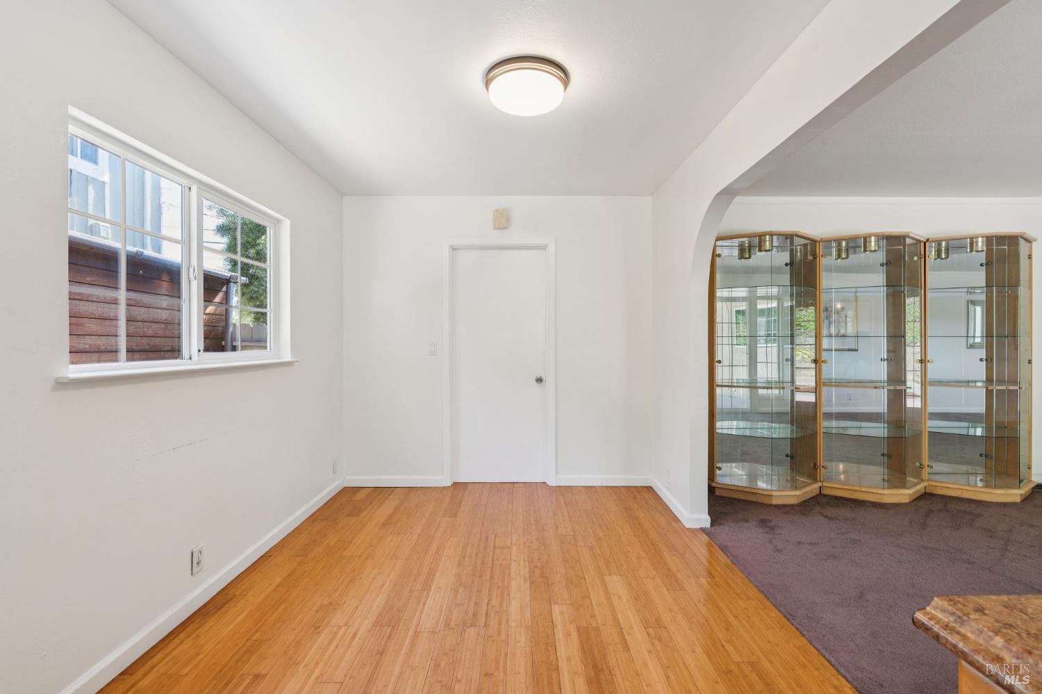 546 Pinewood Drive San Rafael, CA 94903 - Photo 15 of 52 a view of empty room with wooden floor and fan