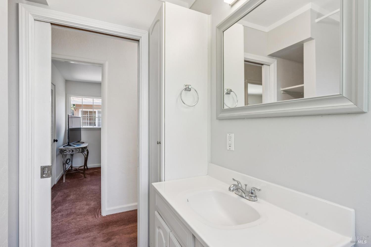 546 Pinewood Drive San Rafael, CA 94903 - Photo 33 of 52 a bathroom with a sink and a mirror