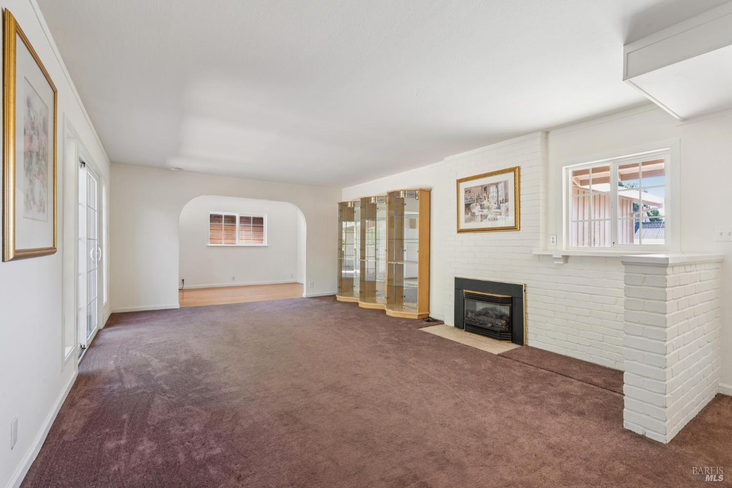 546 Pinewood Drive San Rafael, CA 94903 - Photo 7 of 52 an empty room with windows and fireplace