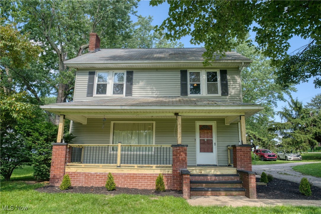 2161 Canton Road Akron, OH 44312 - Photo 1 of 33 Traditional style home featuring covered porch and a chimney