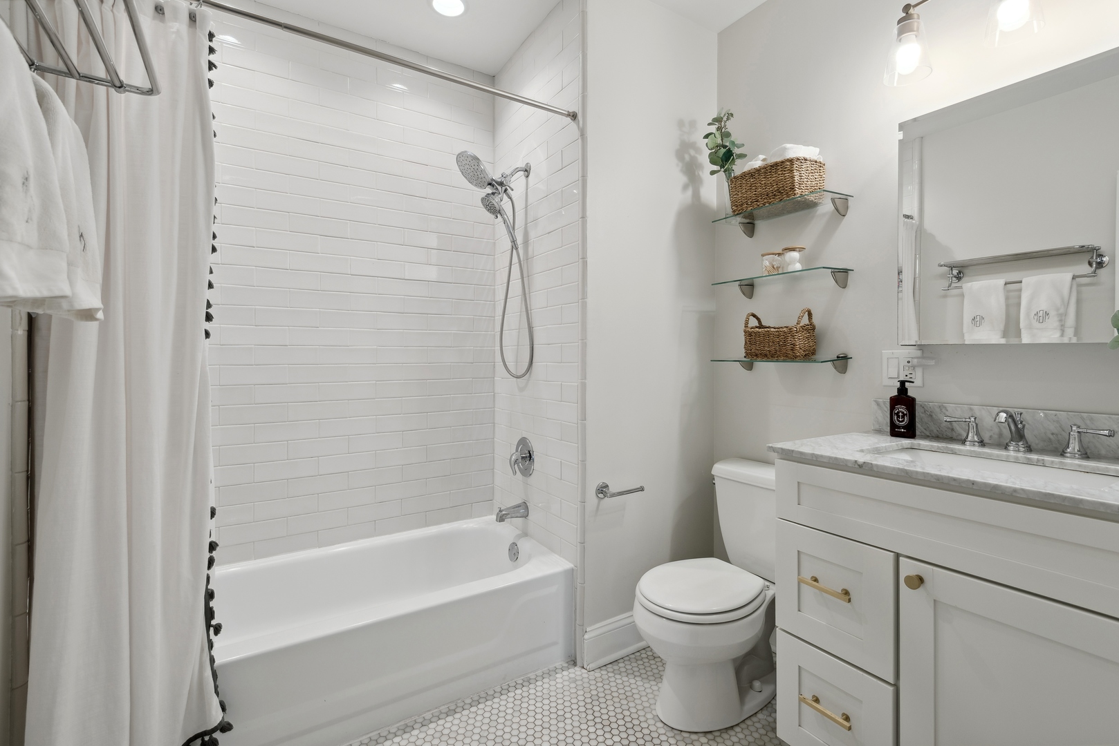 1327 West Roscoe Street, Unit 2 Chicago, IL 60657 - Photo 16 of 32 a bathroom with a sink toilet and shower