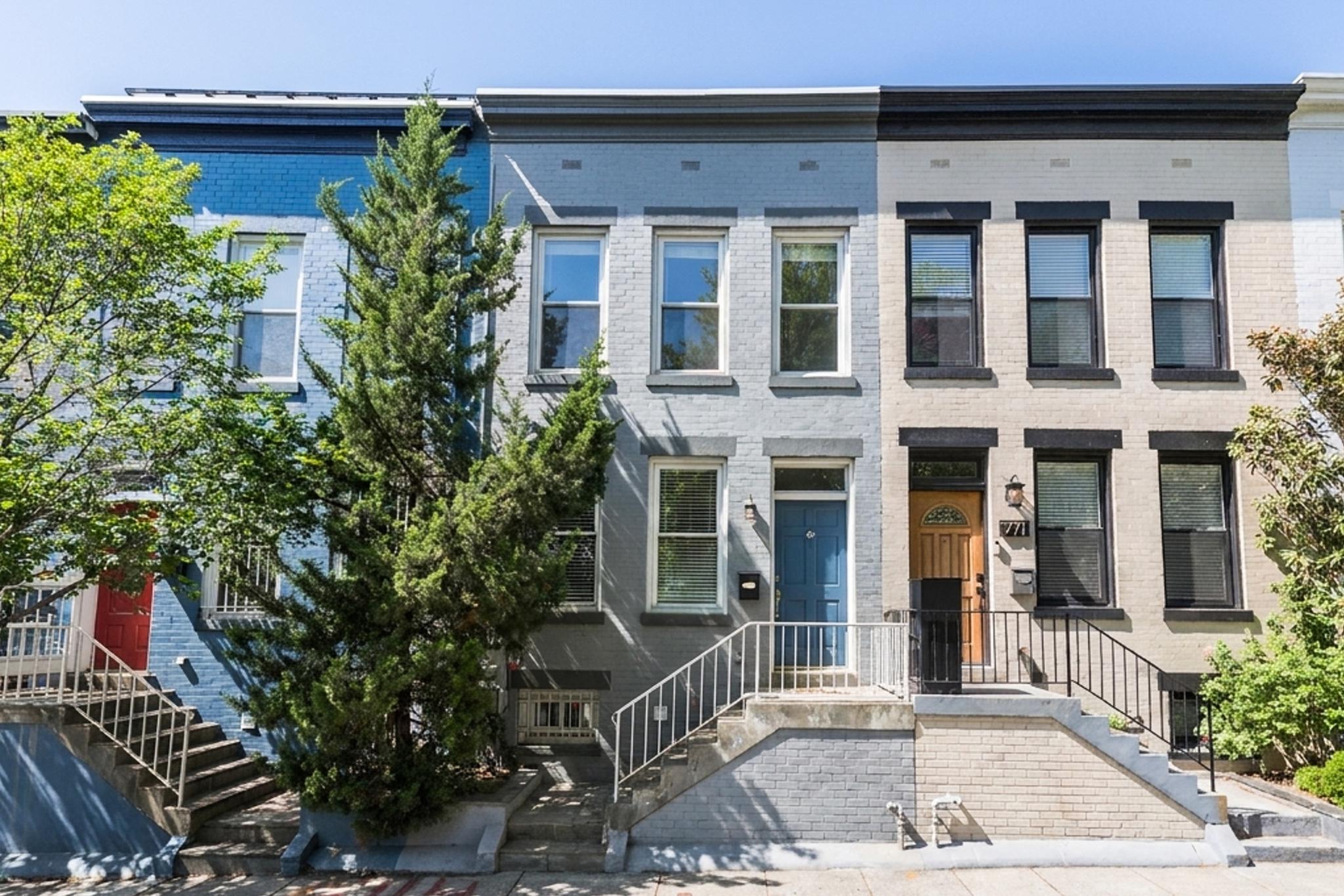 773 Kenyon Street Northwest Washington, DC 20010 - Photo 1 of 17 front view of a brick house with a large window