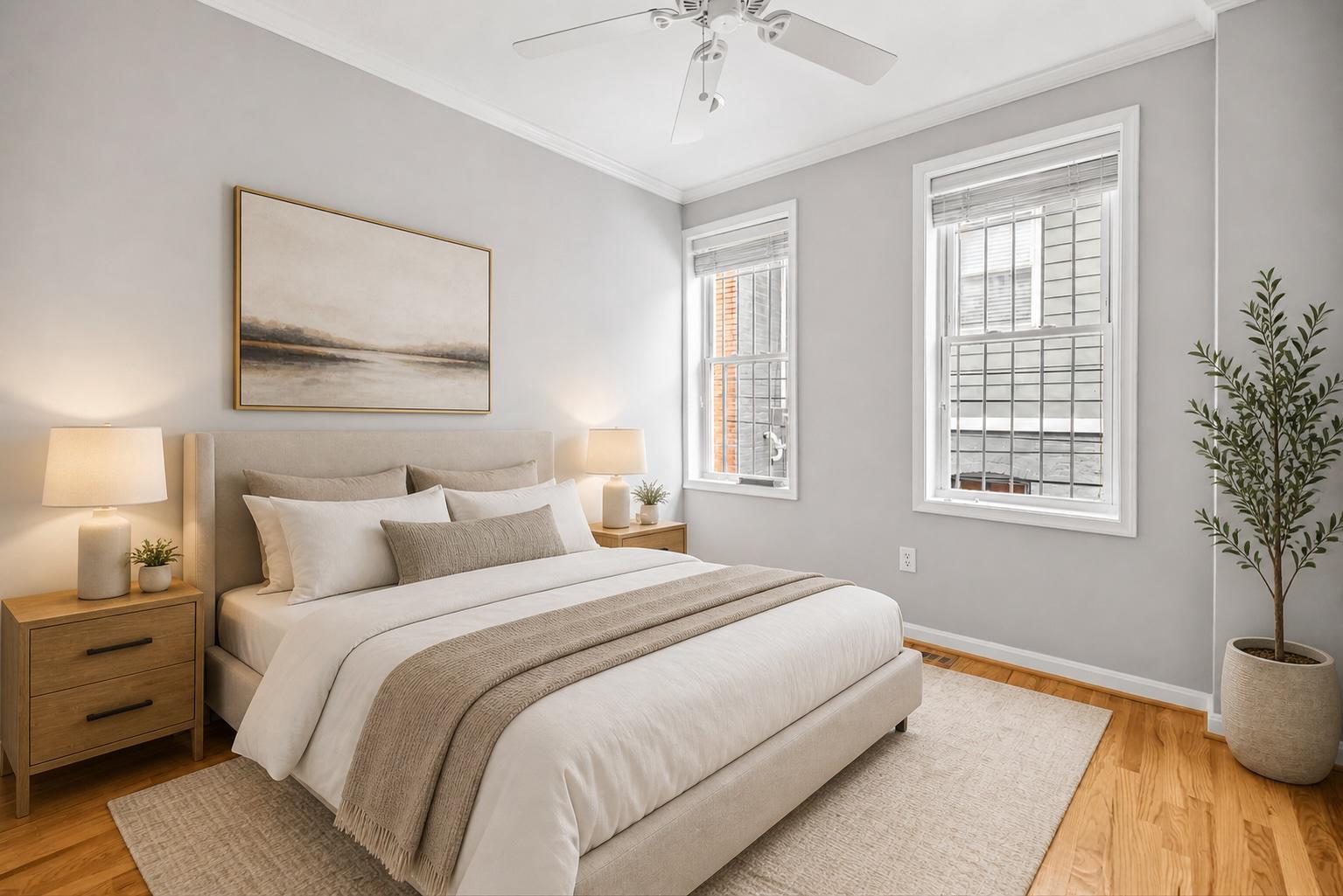 773 Kenyon Street Northwest Washington, DC 20010 - Photo 13 of 17 a bedroom with a large bed and a potted plant