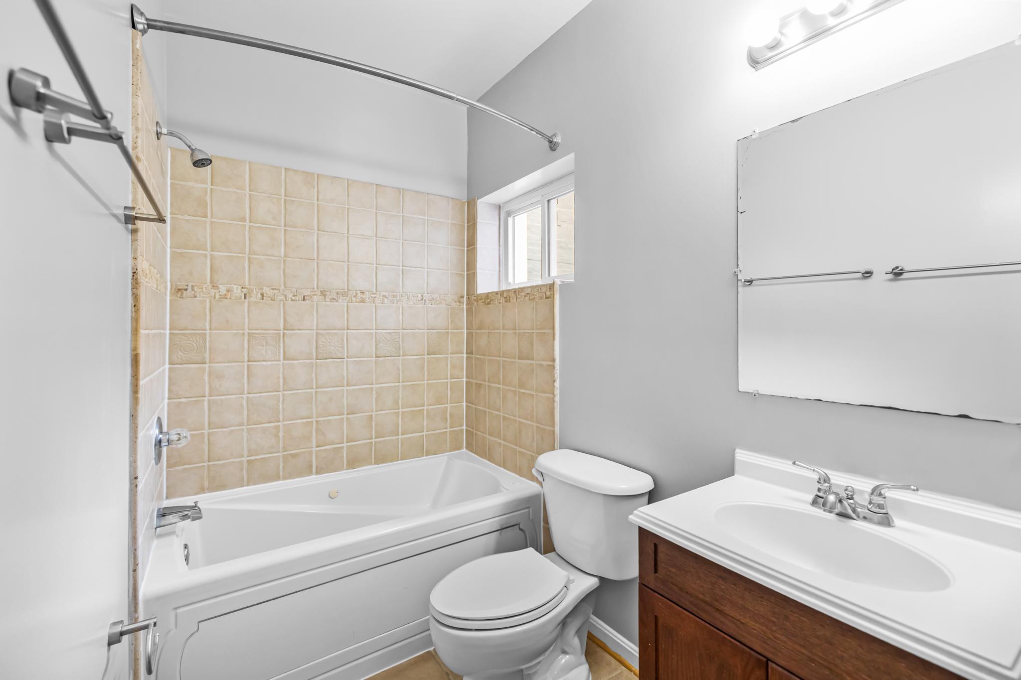 773 Kenyon Street Northwest Washington, DC 20010 - Photo 14 of 17 a bathroom with a sink a toilet and a bathtub