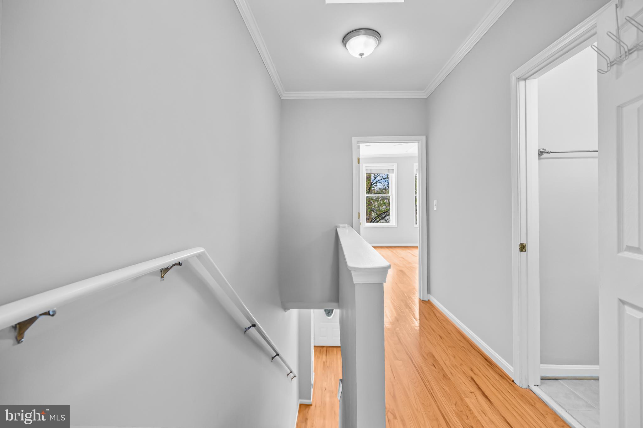 773 Kenyon Street Northwest Washington, DC 20010 - Photo 10 of 17 a view of a hallway with wooden floor and entryway