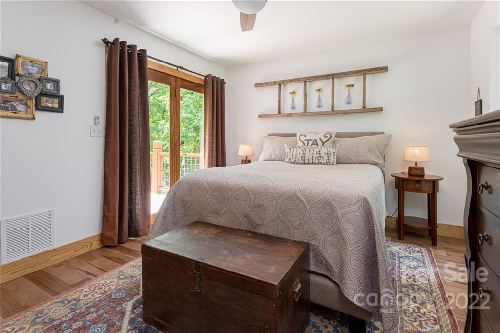 29 Spring Lane Fairview, NC 28730 - Photo 15 of 43 a bedroom with a bed and a window