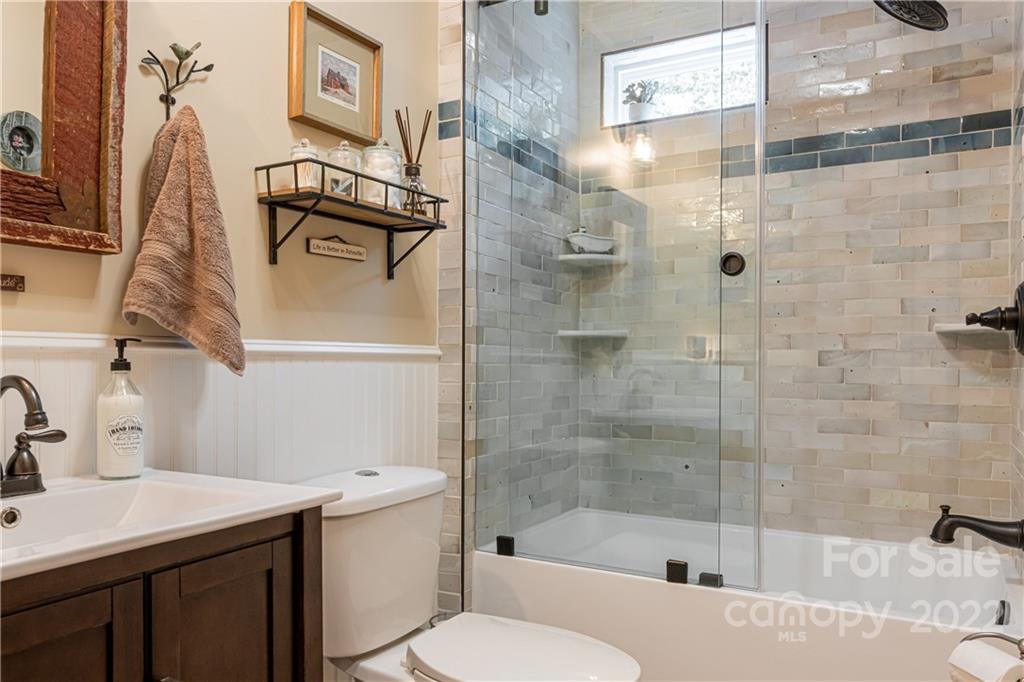 29 Spring Lane Fairview, NC 28730 - Photo 17 of 43 a bathroom with a sink toilet and shower