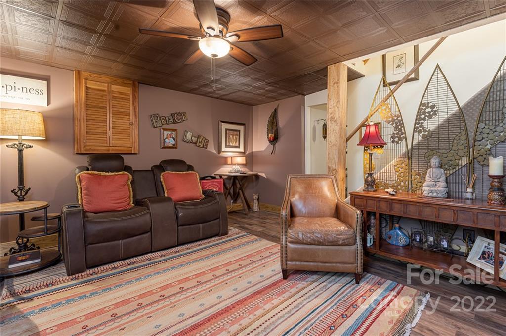 29 Spring Lane Fairview, NC 28730 - Photo 24 of 43 a living room with furniture and a fireplace