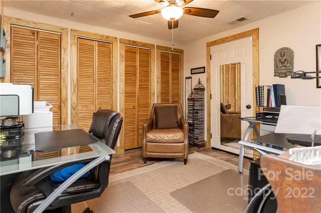 29 Spring Lane Fairview, NC 28730 - Photo 25 of 43 a living room with furniture and a window