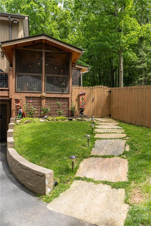 29 Spring Lane Fairview, NC 28730 - Photo 27 of 43 a front view of a house with a yard