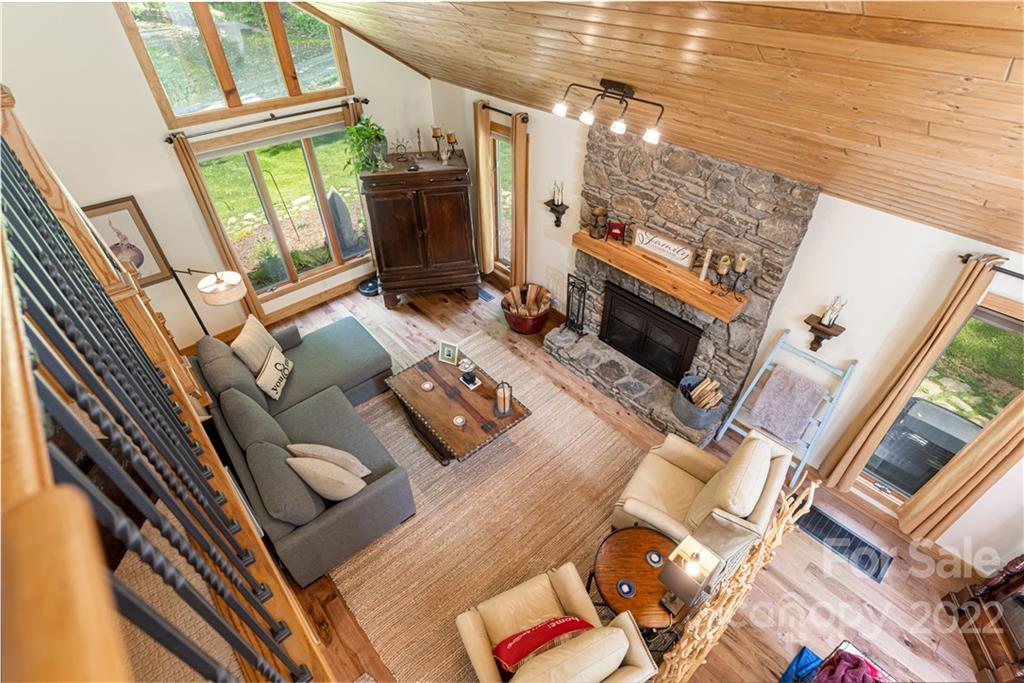 29 Spring Lane Fairview, NC 28730 - Photo 3 of 43 a living room with furniture and a fireplace