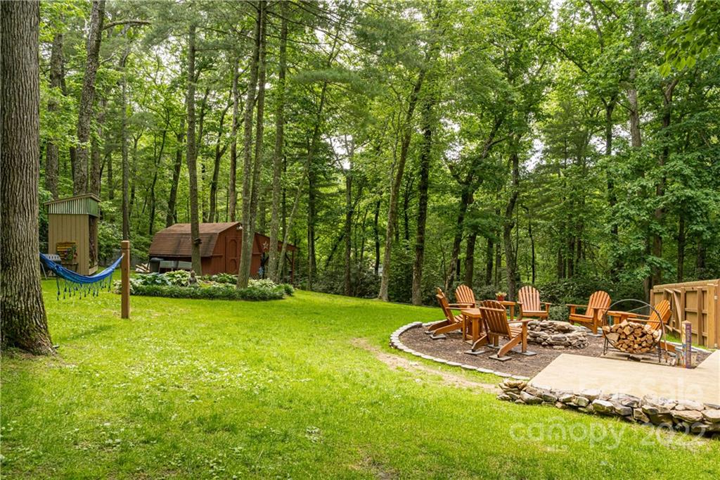 29 Spring Lane Fairview, NC 28730 - Photo 31 of 43 a view of a chair and table on the garden