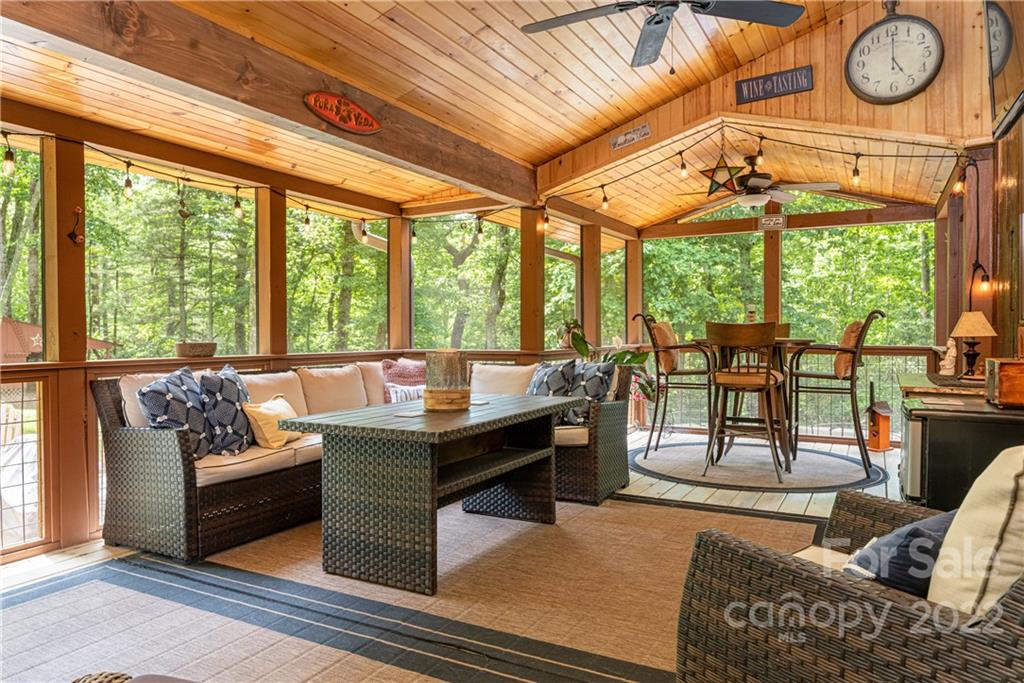 29 Spring Lane Fairview, NC 28730 - Photo 35 of 43 a living room with furniture and a floor to ceiling window