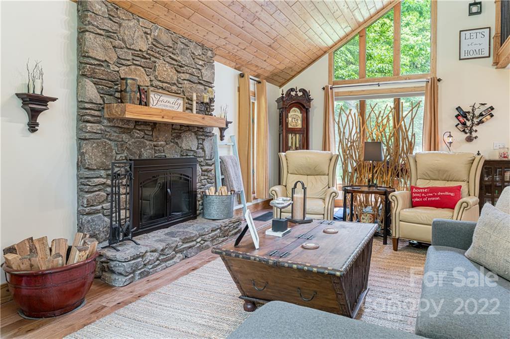 29 Spring Lane Fairview, NC 28730 - Photo 10 of 43 a living room with furniture and a fireplace