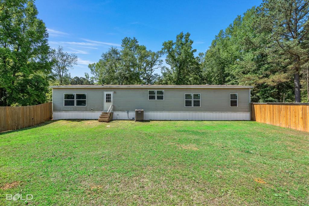 2153 Highway 2 Plain Dealing, LA 71064 - Photo 10 of 39 front view of a house with a yard