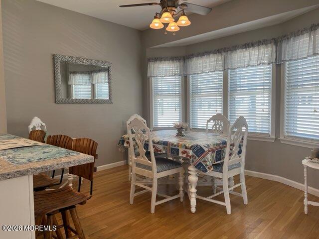 119 Randall Avenue, Unit A Point Pleasant Beach, NJ 08742 - Photo 14 of 27 a view of a dining room with furniture window and wooden floor