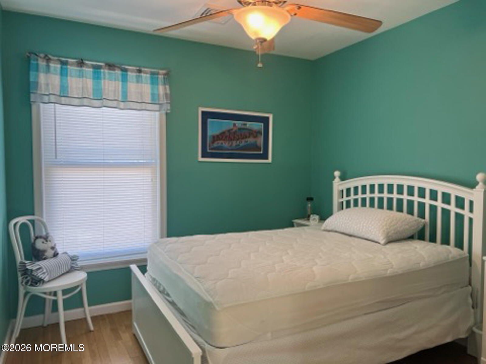 119 Randall Avenue, Unit A Point Pleasant Beach, NJ 08742 - Photo 16 of 27 a bedroom with a bed and a chair
