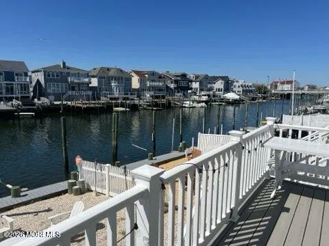 a balcony with view of city and a lake