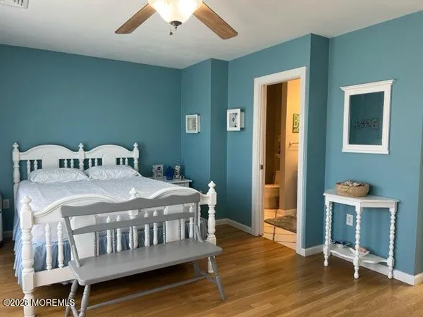 a bedroom with a bed and a desk