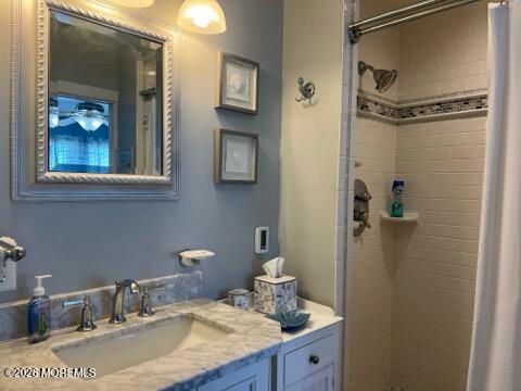 119 Randall Avenue, Unit A Point Pleasant Beach, NJ 08742 - Photo 22 of 27 a bathroom with a granite countertop sink a light fixture and a mirror