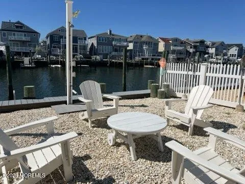 a view of a roof deck with furniture