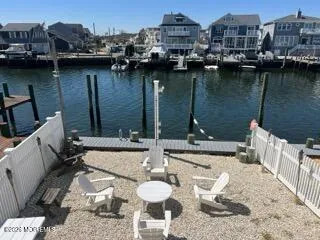 a view of a balcony with chairs and a table