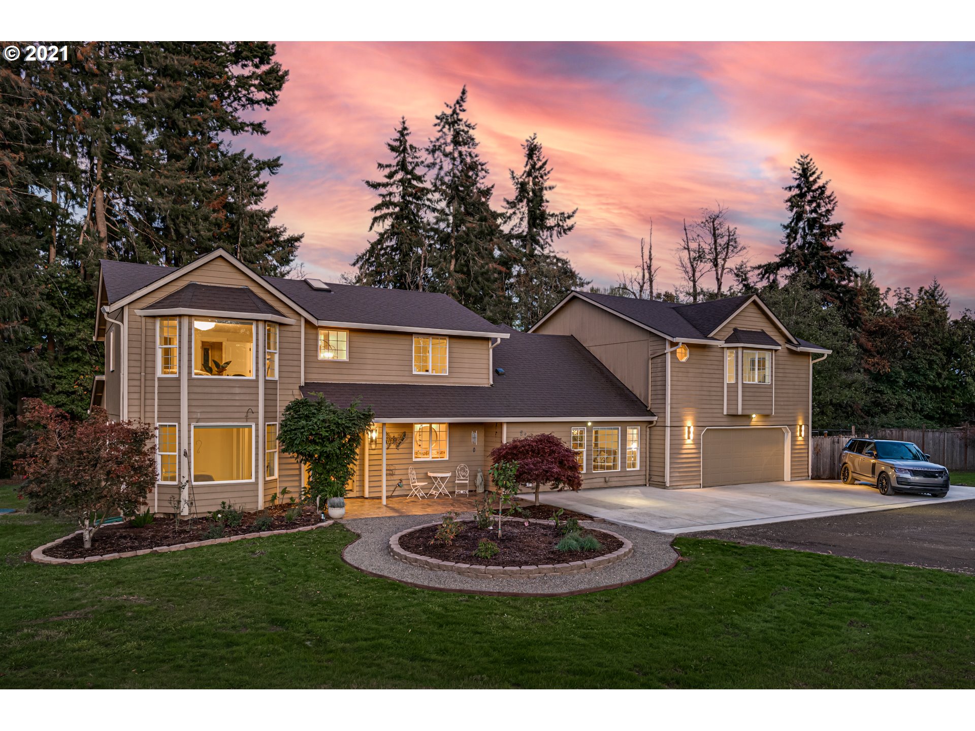 29010 Northwest 2nd Avenue Ridgefield, WA 98642 - Photo 1 of 32 a front view of a house with a yard and garage