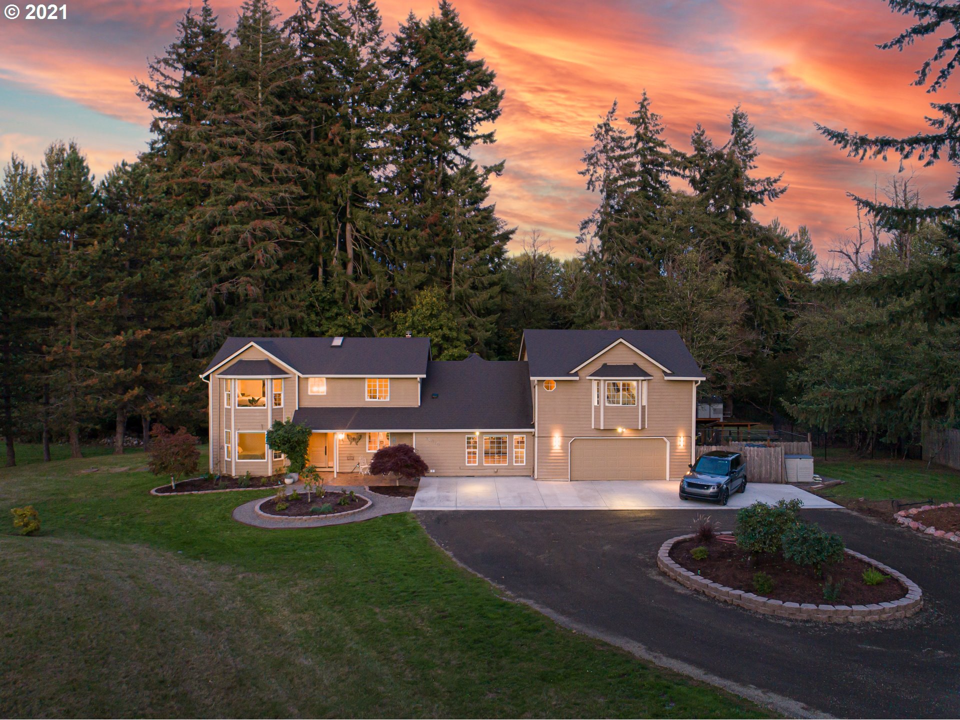 29010 Northwest 2nd Avenue Ridgefield, WA 98642 - Photo 2 of 32 a front view of a house with a yard and garage