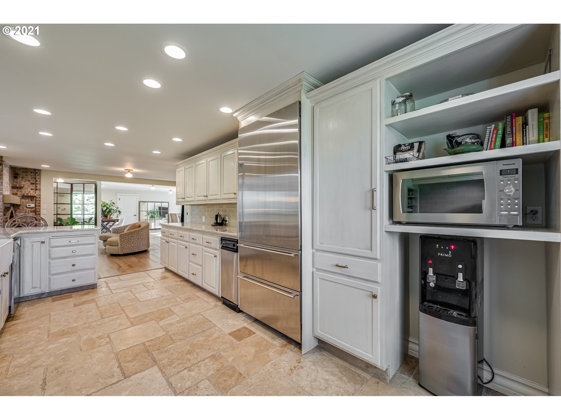 29010 Northwest 2nd Avenue Ridgefield, WA 98642 - Photo 11 of 32 a kitchen with stainless steel appliances kitchen island granite countertop a refrigerator and cabinets