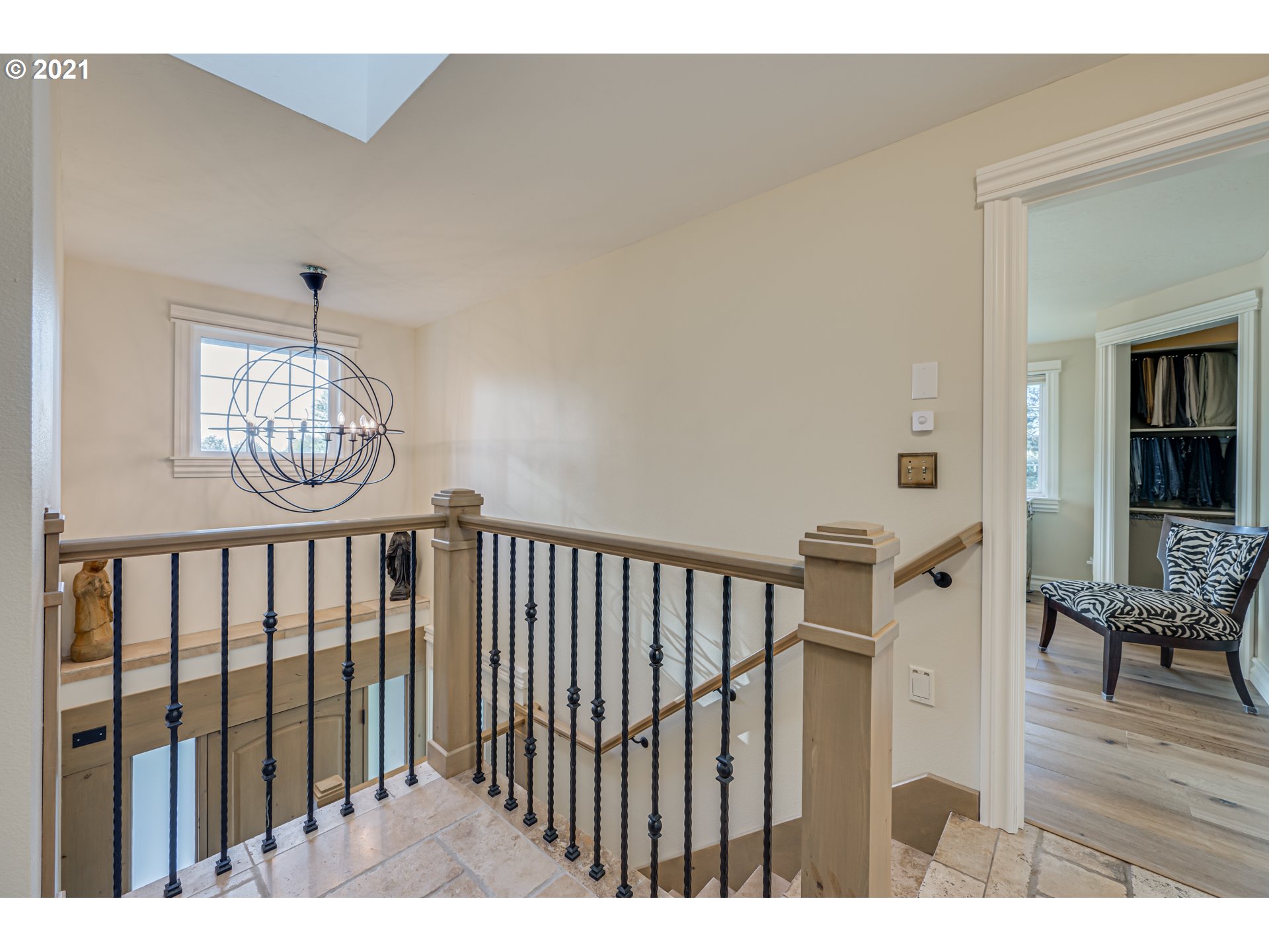 29010 Northwest 2nd Avenue Ridgefield, WA 98642 - Photo 18 of 32 a view of staircase with wooden floor and a chandelier