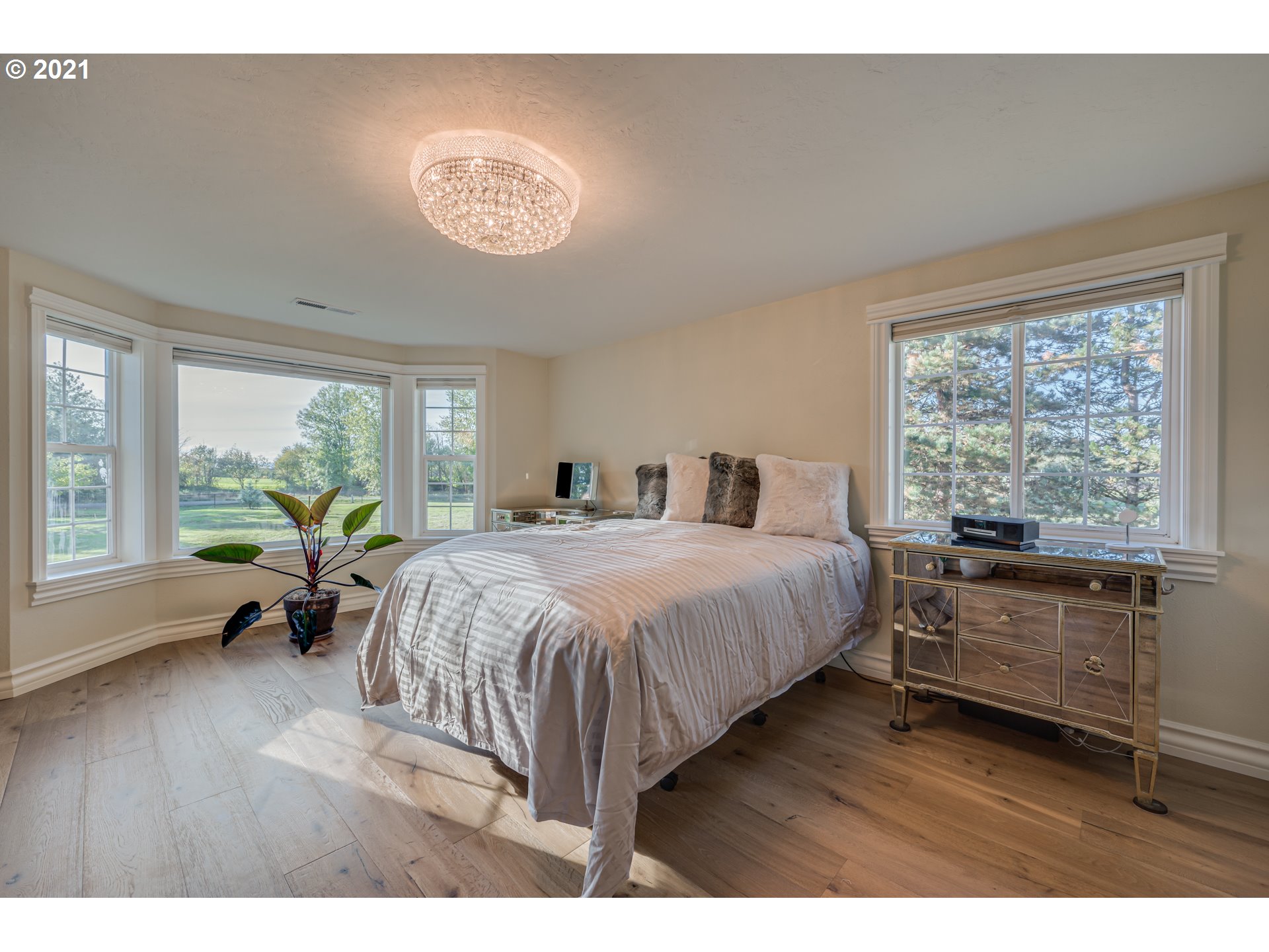 29010 Northwest 2nd Avenue Ridgefield, WA 98642 - Photo 19 of 32 a spacious bedroom with a bed and a large window