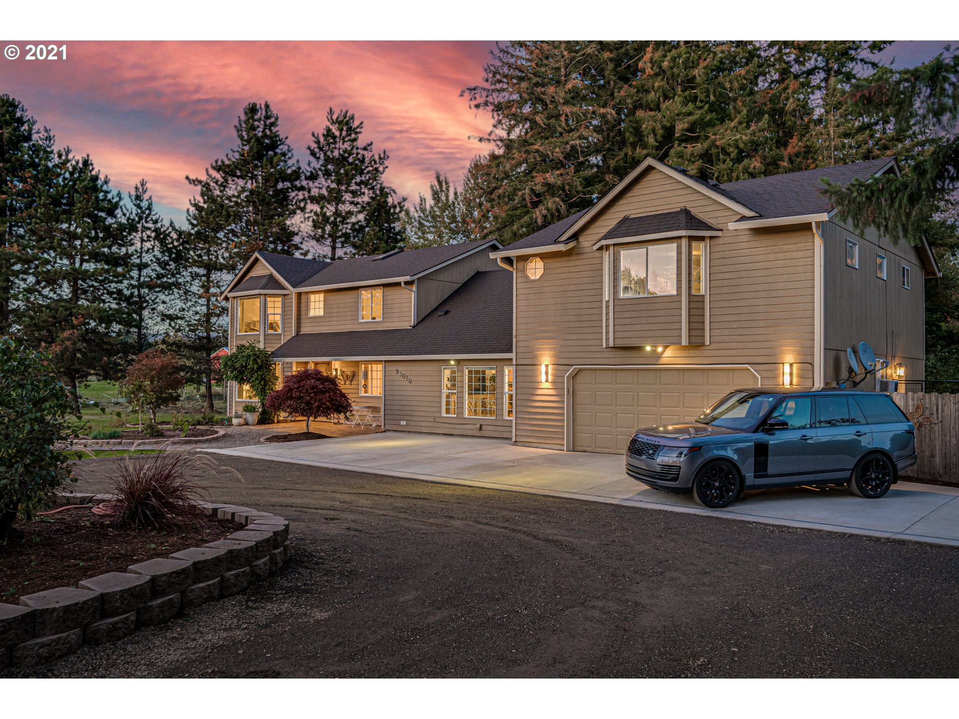 29010 Northwest 2nd Avenue Ridgefield, WA 98642 - Photo 3 of 32 a car parked in front of a house
