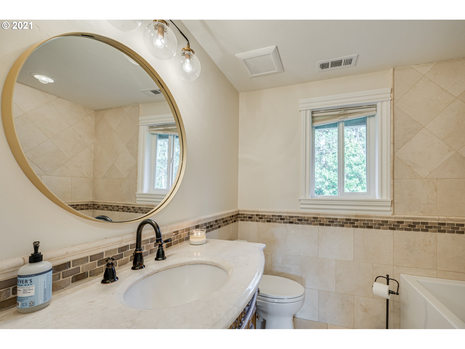 29010 Northwest 2nd Avenue Ridgefield, WA 98642 - Photo 25 of 32 a bathroom with a sink and a mirror