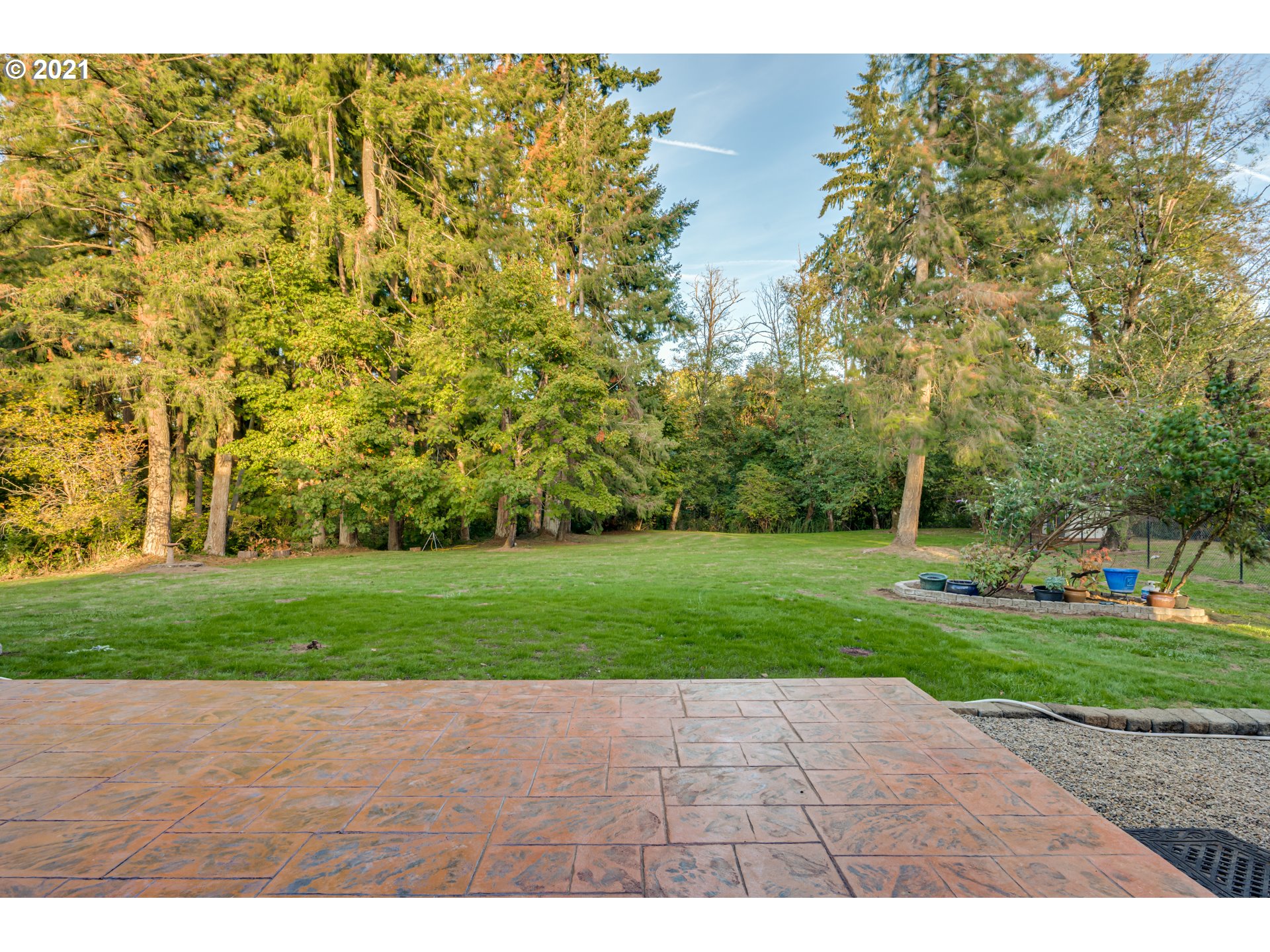 29010 Northwest 2nd Avenue Ridgefield, WA 98642 - Photo 30 of 32 a wooden bench sitting in the middle of a yard
