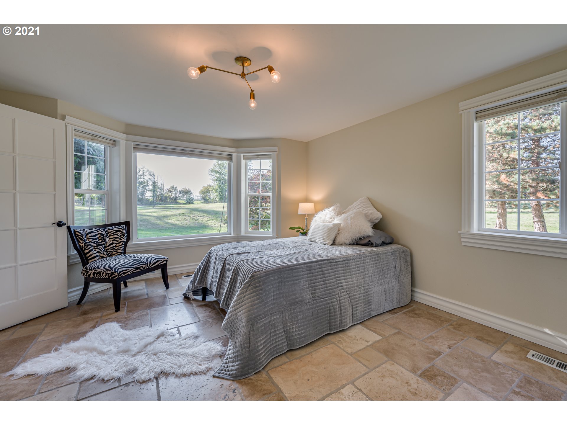29010 Northwest 2nd Avenue Ridgefield, WA 98642 - Photo 6 of 32 a bedroom with a bed chair and window
