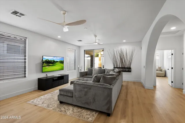 a living room with fireplace furniture and a flat screen tv