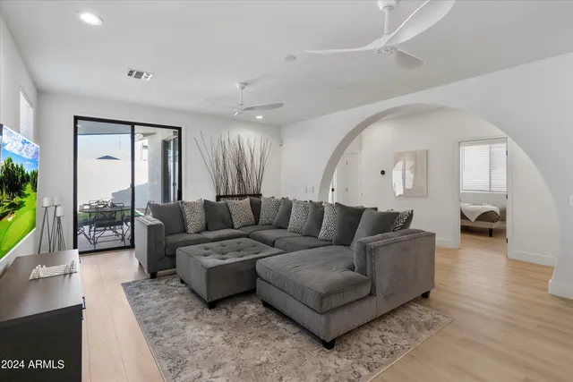 a living room with furniture and a large window