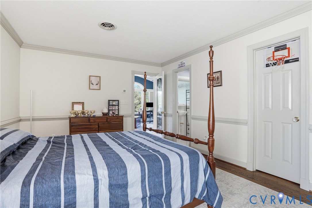 13300 West Patrick Henry Road Doswell, VA 23047 - Photo 35 of 69 Bedroom featuring wood-finish flooring, two-tone w