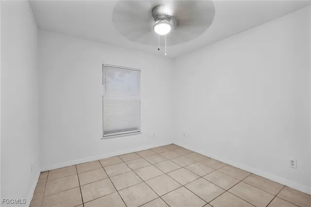 an empty room with a empty space and window