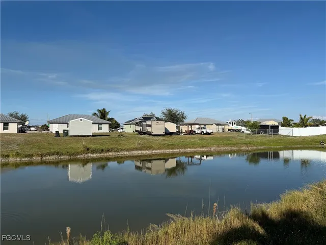 a view of ocean with residential houses with outdoor space
